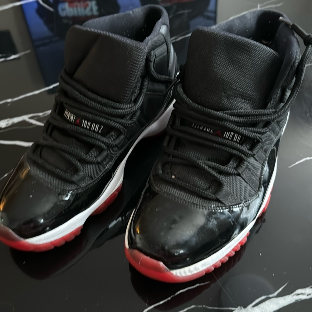 Preowned Jordan 11 bred Sz 10.5.    Need Sole Reglue
